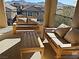 Relaxing balcony with wooden furniture and mountain views at 3041 Savella Ave, Henderson, NV 89044