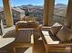 Relaxing balcony with wooden furniture and mountain views at 3041 Savella Ave, Henderson, NV 89044