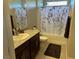 Spa-like bathroom with a shower/tub combo and granite countertop at 3041 Savella Ave, Henderson, NV 89044