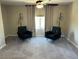 Relaxing bedroom with two armchairs and plenty of natural light at 3041 Savella Ave, Henderson, NV 89044