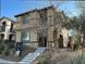 Two-story house with stone accents and a landscaped front yard at 3041 Savella Ave, Henderson, NV 89044