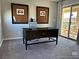 Home office with a desk, chair, and access to a balcony at 3041 Savella Ave, Henderson, NV 89044