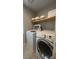 Laundry room with washer, dryer, and shelving at 3041 Savella Ave, Henderson, NV 89044