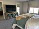 Bedroom with king-size bed, large TV, and access to balcony at 3041 Savella Ave, Henderson, NV 89044