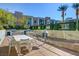 Outdoor BBQ area with a large table and built-in grills at 353 E Bonneville Ave # 385, Las Vegas, NV 89101