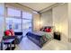 Modern bedroom with city view, large windows, and comfortable seating at 353 E Bonneville Ave # 385, Las Vegas, NV 89101