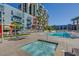 Resort-style pool and hot tub with surrounding lounge area at 353 E Bonneville Ave # 385, Las Vegas, NV 89101