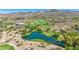 Community clubhouse and serene pond surrounded by lush greenery at 37 Stonemark Dr, Henderson, NV 89052