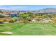 Homes overlooking a lush golf course and city skyline at 37 Stonemark Dr, Henderson, NV 89052