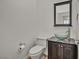 Modern bathroom with glass bowl sink and dark vanity at 37 Stonemark Dr, Henderson, NV 89052