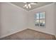 Well-lit bedroom featuring ceiling fan and window shutters at 37 Stonemark Dr, Henderson, NV 89052