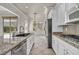 Modern kitchen with granite countertops and island at 37 Stonemark Dr, Henderson, NV 89052