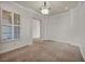 Spacious living room with neutral carpeting and plantation shutters at 37 Stonemark Dr, Henderson, NV 89052