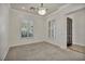 Bright living room with neutral carpeting and plantation shutters at 37 Stonemark Dr, Henderson, NV 89052