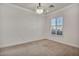 Bright living room with neutral carpeting and plantation shutters at 37 Stonemark Dr, Henderson, NV 89052