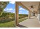 Covered patio with ceiling fans, extending from the back of the house at 37 Stonemark Dr, Henderson, NV 89052