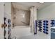 Main bathroom with a shower/tub combo and patterned tile at 3767 Monument St, Las Vegas, NV 89121