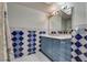 Bathroom with blue and white diamond patterned tile and a double vanity at 3767 Monument St, Las Vegas, NV 89121