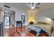 Bedroom with wood floors and mirrored closet doors leading to the bathroom at 3767 Monument St, Las Vegas, NV 89121