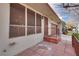 Front entry with brick walkway and security screen door at 3767 Monument St, Las Vegas, NV 89121