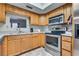 Kitchen features stainless steel appliances and oak cabinets at 3767 Monument St, Las Vegas, NV 89121