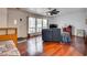 Living room with hardwood floors, ceiling fan, and comfy seating at 3767 Monument St, Las Vegas, NV 89121