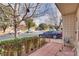 Small patio area with wrought iron railings and shrubs at 3767 Monument St, Las Vegas, NV 89121