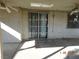 Covered back patio with ceiling fan and sliding glass door at 384 Norlina Ct, Henderson, NV 89014