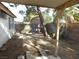 Backyard view with dirt, tree and shed at 384 Norlina Ct, Henderson, NV 89014