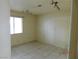 Small bedroom with tile floors and a window at 384 Norlina Ct, Henderson, NV 89014