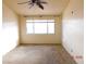 Bright bedroom featuring a ceiling fan and large window at 384 Norlina Ct, Henderson, NV 89014