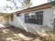 Side of house with window and security bars at 384 Norlina Ct, Henderson, NV 89014