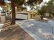 House exterior showcasing a driveway and landscaping at 384 Norlina Ct, Henderson, NV 89014