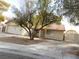 Single story home with a two car garage and driveway at 384 Norlina Ct, Henderson, NV 89014