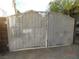 White metal gate leading to the backyard at 384 Norlina Ct, Henderson, NV 89014