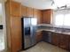 Kitchen with stainless steel appliances and wood cabinets at 384 Norlina Ct, Henderson, NV 89014