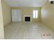 Living room with tile floors, fireplace and sliding door at 384 Norlina Ct, Henderson, NV 89014