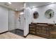 Bathroom with walk-in shower and double sinks at 3990 Melody Ln, Las Vegas, NV 89108