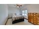 Bedroom with a multicolored quilt and an antique wooden chest at 3990 Melody Ln, Las Vegas, NV 89108