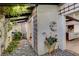 Peaceful courtyard featuring plants, stone pathway and wooden accents at 3990 Melody Ln, Las Vegas, NV 89108