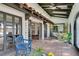 Peaceful courtyard with tiled floor, fountain and seating area at 3990 Melody Ln, Las Vegas, NV 89108