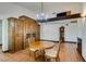 Bright dining room with a chandelier, tile floors, and built-in cabinetry at 3990 Melody Ln, Las Vegas, NV 89108