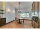 Bright dining room with a chandelier, tile floors, and built-in cabinetry at 3990 Melody Ln, Las Vegas, NV 89108