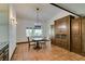 Bright dining room with a chandelier, tile floors, and built-in cabinetry at 3990 Melody Ln, Las Vegas, NV 89108