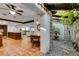 Kitchen features granite countertops, wooden cabinetry, and a charming courtyard view at 3990 Melody Ln, Las Vegas, NV 89108