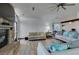 Living room with a stone fireplace, hardwood floors, and comfortable seating at 3990 Melody Ln, Las Vegas, NV 89108