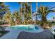 Relaxing pool area with a kidney-shaped pool and spa, perfect for entertaining at 3990 Melody Ln, Las Vegas, NV 89108