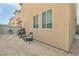 Small backyard with grill and patio furniture at 4070 Emerald Wood St, Las Vegas, NV 89115