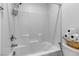 Clean bathroom with white tile and a bathtub at 4070 Emerald Wood St, Las Vegas, NV 89115