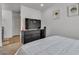 Bedroom with TV, dresser, and window at 4070 Emerald Wood St, Las Vegas, NV 89115